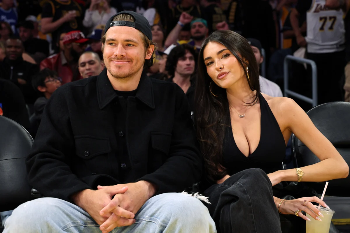 Quarterback Justin Herbert #10 of the Los Angeles Chargers and Madison Beer attend a basketball game between Los Angeles Lakers and Minnesota Timberwolves at Crypto.com Arena on October 24, 2025 in Los Angeles, California.